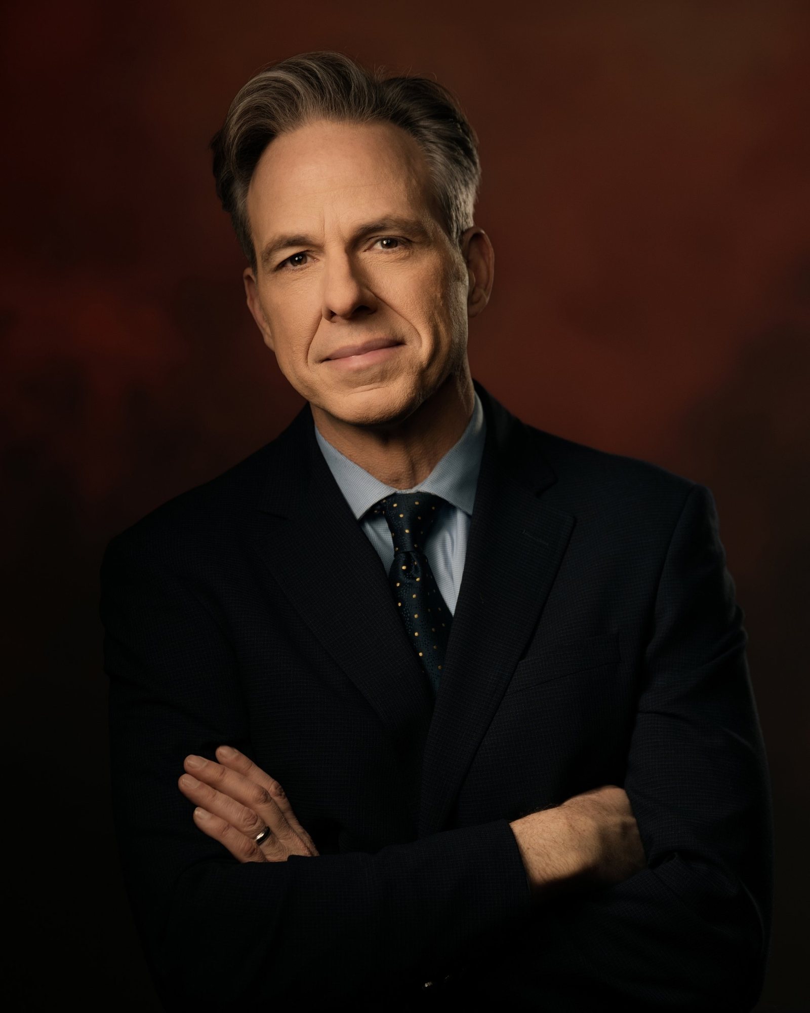 Jake Tapper, arms crossed, portrait